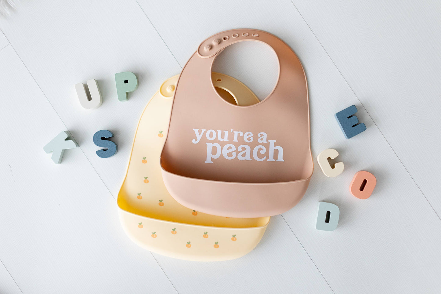 Pearhead - Baby Bib Set, You’re a Peach, Silicone, Set of 2