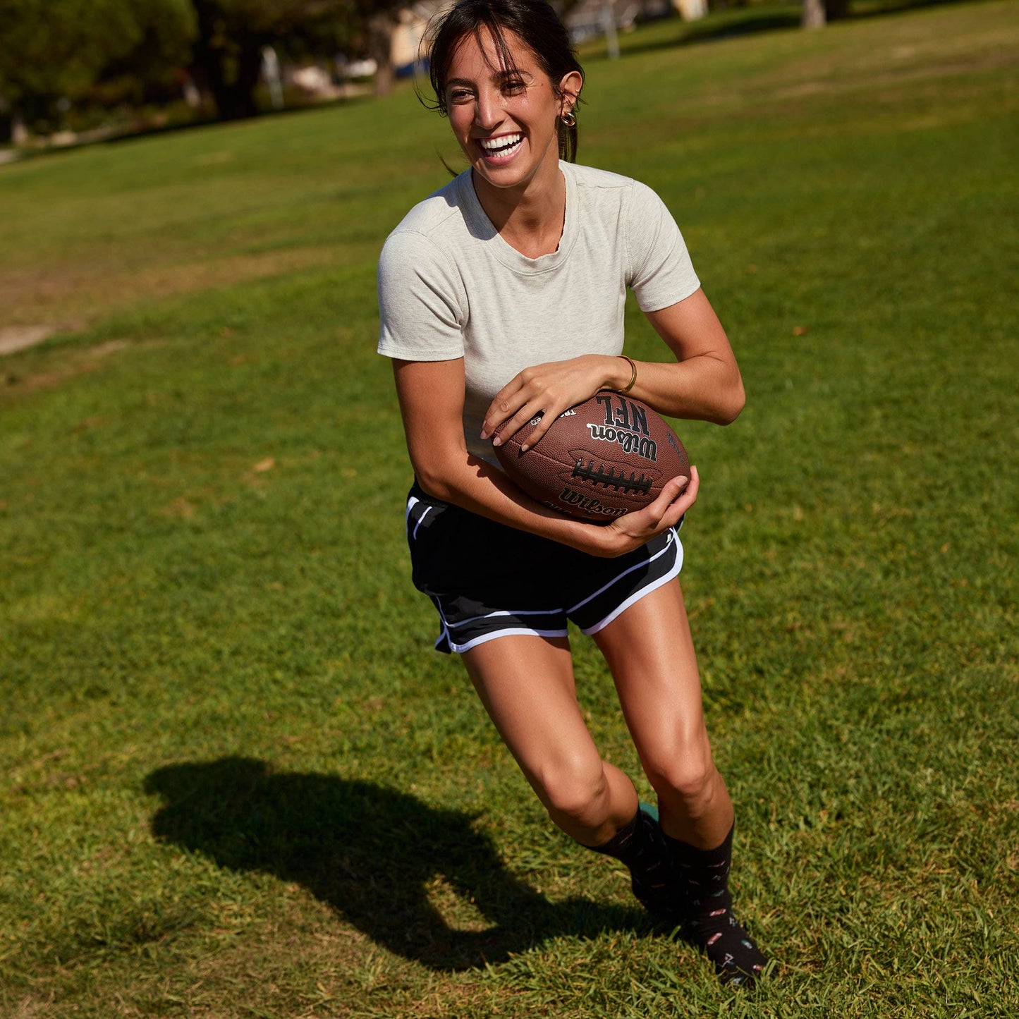Conscious Step - Socks that Support Youth Sports | Black Footballs