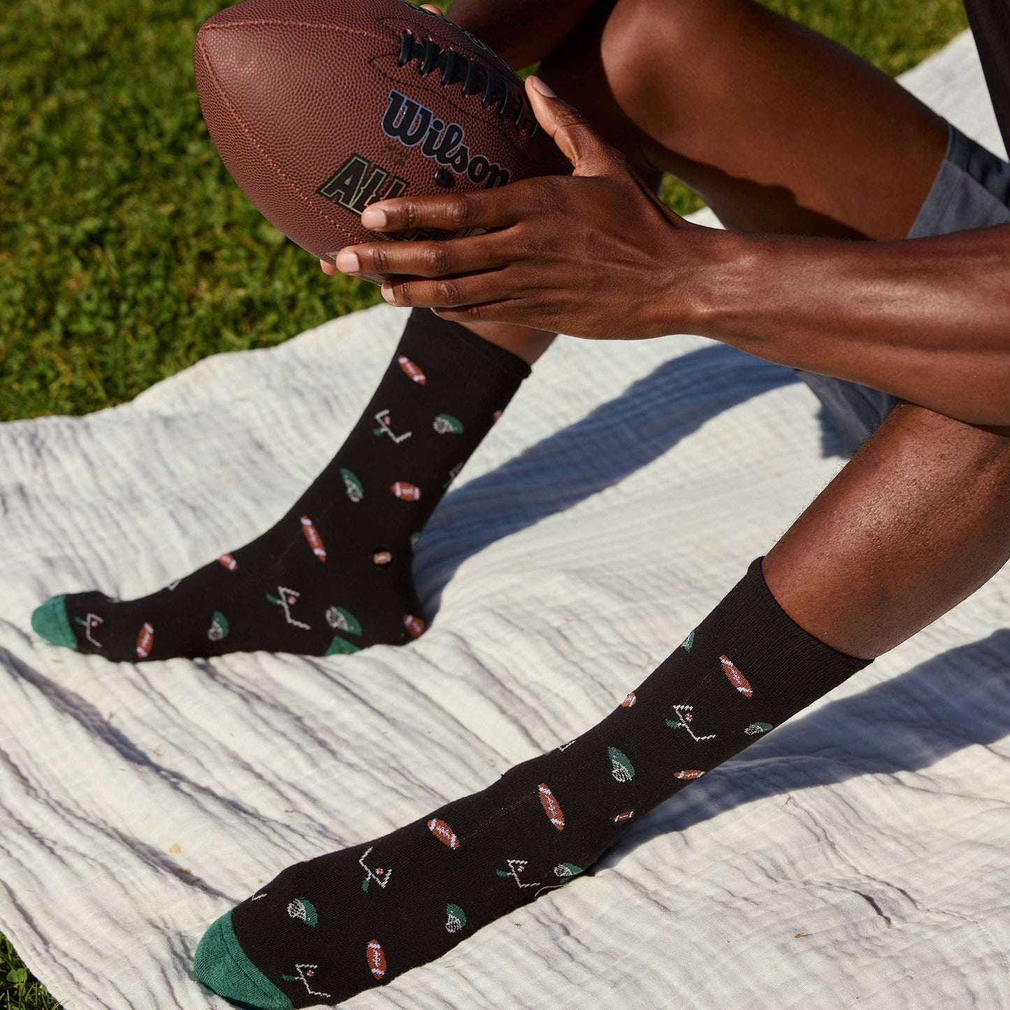 Conscious Step - Socks that Support Youth Sports | Black Footballs