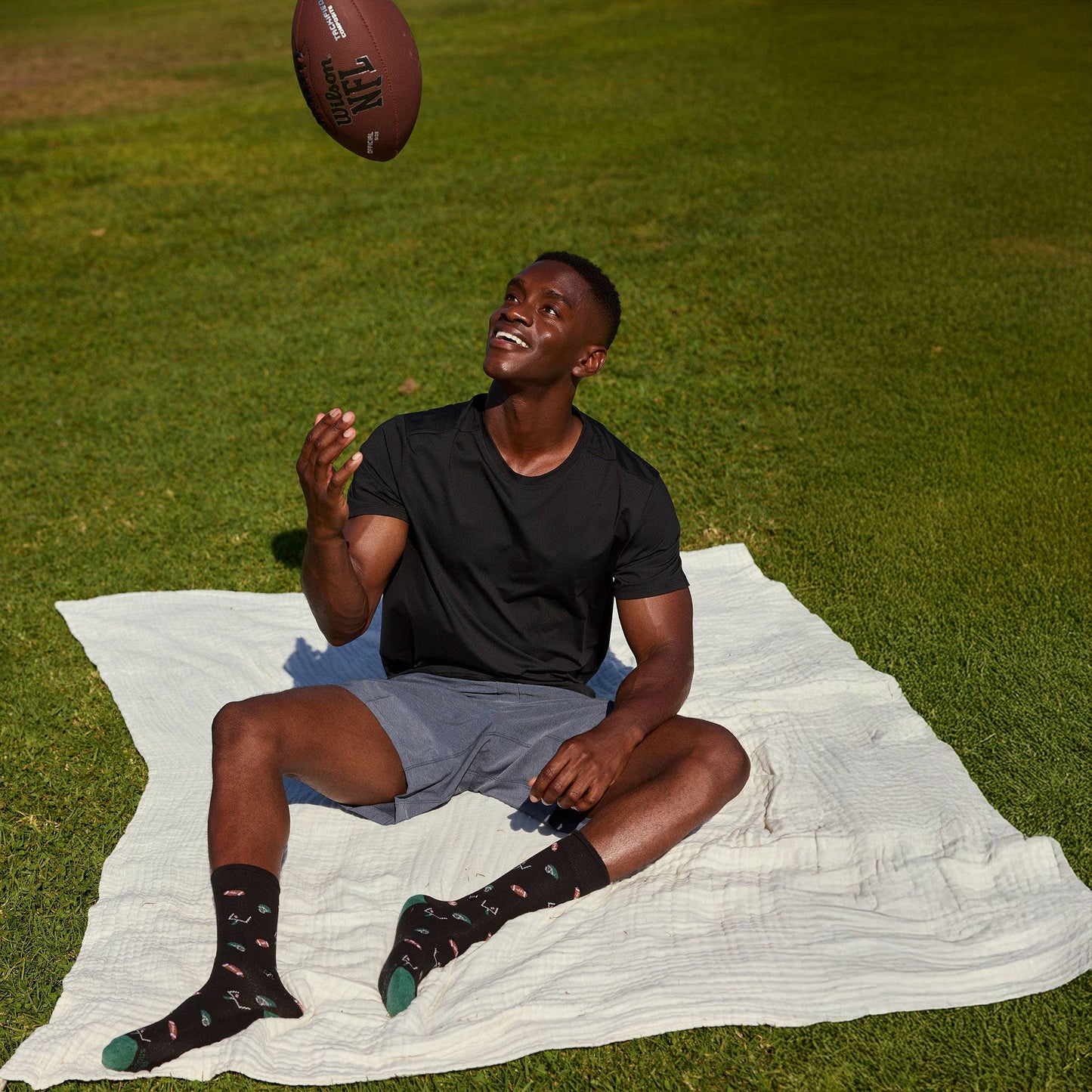Conscious Step - Socks that Support Youth Sports | Black Footballs