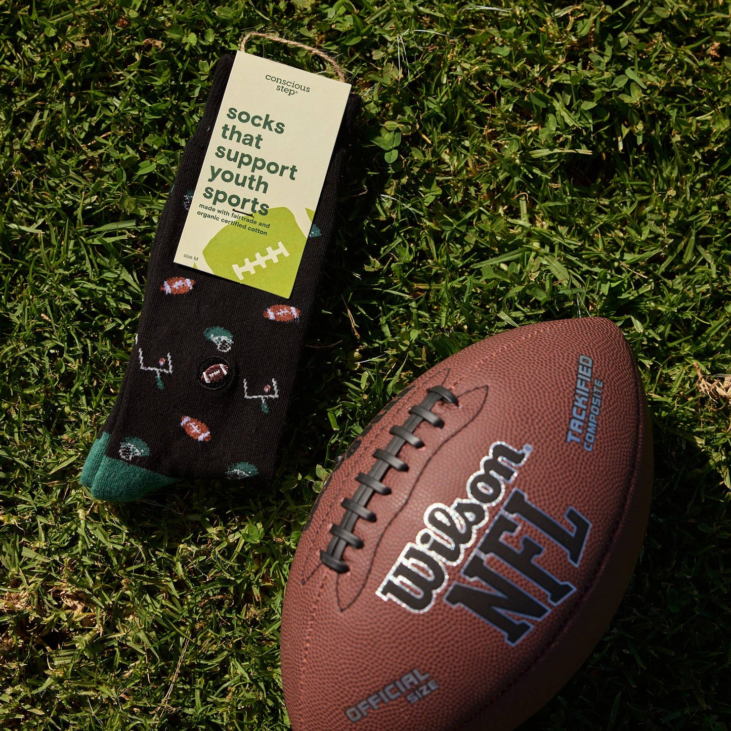 Conscious Step - Socks that Support Youth Sports | Black Footballs